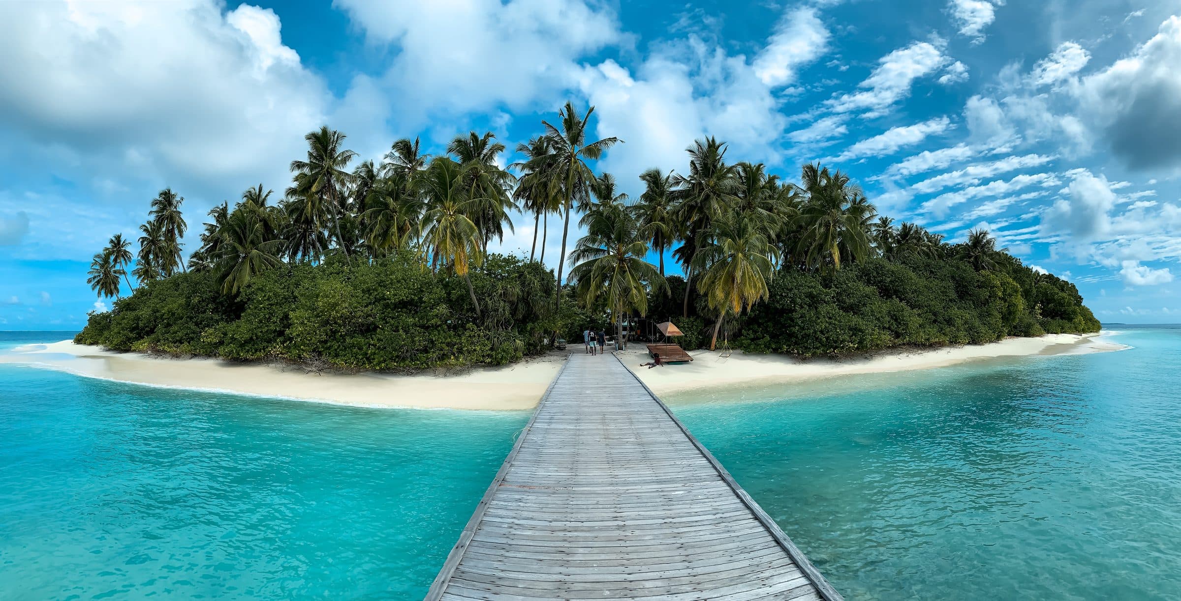 Jetty structure extending over shallow water at an island site